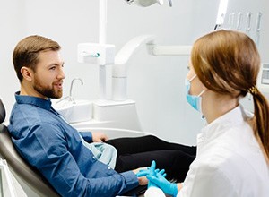 Dentist and patient talking during consultation