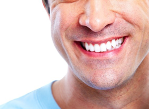 Close up of man smiling with straight white teeth