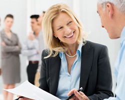 Confident, mature woman in business setting