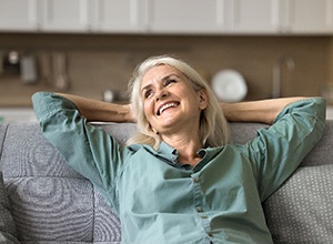 Senior woman resting on sofa at home