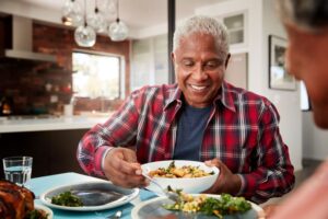 Happy older couple enjoying a meal together